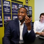 Republican U.S. Senate candidate John  James makes a campaign call at his headquarters in Livonia, Mich., Monday, Aug. 6, 2018. (AP Photo/Paul Sancya)