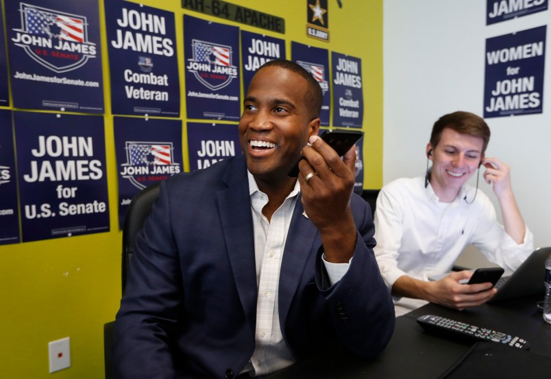 Republican U.S. Senate candidate John  James makes a campaign call at his headquarters in Livonia, Mich., Monday, Aug. 6, 2018. (AP Photo/Paul Sancya)