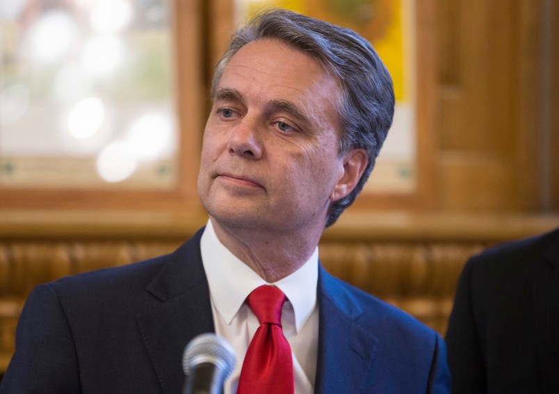 Kansas governor Jeff Colyer talks to reporters in Topeka, Kan., on Wednesday, Aug. 8, 2018, a day after his primary race against Kansas Secretary of State Kris Kobach. Colyer is currently 191 votes behind Kobach and is awaiting the results of mail-in and provisional ballots. (AP Photo/The Wichita Eagle, Travis Heying)