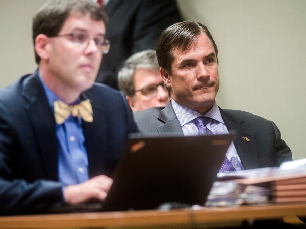 Nick Lyon, director of the Michigan Department of Health and Human Services, listens closely as Genesee District Judge David J. Goggins gives his decision during Lyon's preliminary examination on Monday, Aug. 20, 2018 at Genesee District Court in downtown Flint. Goggins bound Lyon's case over to Genesee Circuit Court for trial on two counts of involuntary manslaughter for the deaths of Robert Skidmore and John Snyder, who prosecutors say died as a result of Legionnaires' disease, and one count of misconduct in office. He also faces one misdemeanor count of willful neglect of duty. Jake May | MLive.com Jake May