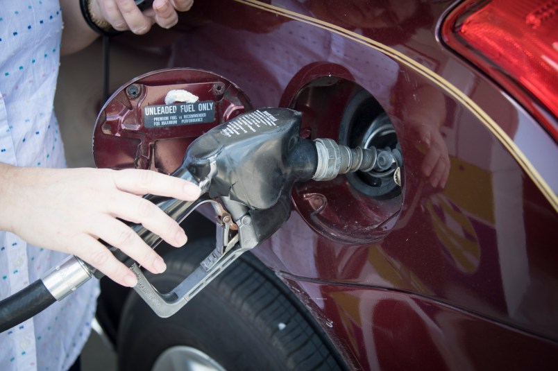 MIAMI, FLORIDA, UNITED STATES - 2017/04/28: Woman's hand holding a pump nozzle in car fuel tank door. She self serve gasoline in her main transportation vehicle. (Photo by Roberto Machado Noa/LightRocket via Getty Images)