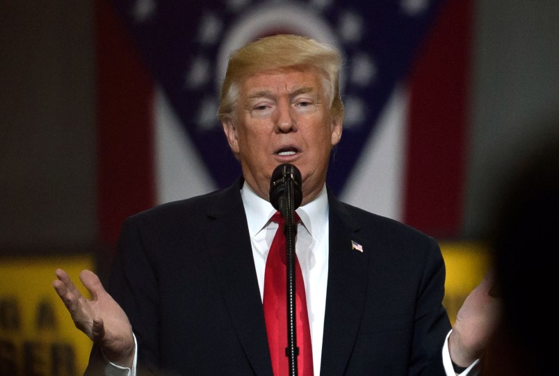 RICHFIELD, OHIO - MARCH 29:  U.S. President Donald Trump speaks to a crowd gathered at the Local 18 Richfield Facility of the Operating Engineers Apprentice and Training, a union and apprentice training center specializing in the repair and operation of heavy equipment on March 29, 2018 in Richfield, Ohio. President Trump's remarks centered upon infrastructure investment in the economy and labor statistics.  (Photo by Jeff Swensen/Getty Images)