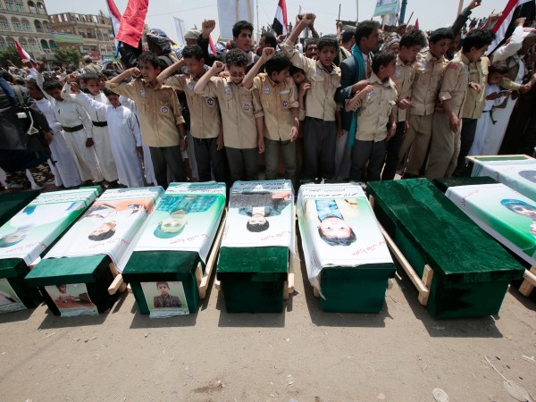 Yemeni people attend the funeral of victims of a Saudi-led airstrike, in Saada, Yemen, Monday, Aug. 13, 2018. Yemen's shiite rebels are backing a United Nations' call for an investigation into the airstrike in the country's north that killed dozens of people including many children. (AP Photo/Hani Mohammed)
