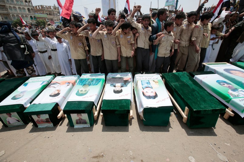 Yemeni people attend the funeral of victims of a Saudi-led airstrike, in Saada, Yemen, Monday, Aug. 13, 2018. Yemen's shiite rebels are backing a United Nations' call for an investigation into the airstrike in the country's north that killed dozens of people including many children. (AP Photo/Hani Mohammed)