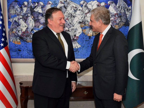 In this photo released by Press Information Department, visiting U.S. Secretary of State Mike Pompeo, left, shakes hand with Pakistan's foreign minister Shah Mahmood Qureshi, prior to their meeting in Islamabad, Pakistan, Wednesday, Sept. 5, 2018. Pompeo arrived in Pakistan on Wednesday at a time when relations between the two countries have sunk to a new low. (Press Information Department via AP)