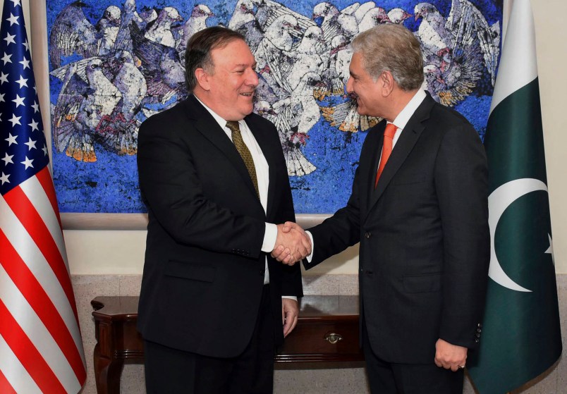 In this photo released by Press Information Department, visiting U.S. Secretary of State Mike Pompeo, left, shakes hand with Pakistan's foreign minister Shah Mahmood Qureshi, prior to their meeting in Islamabad, Pakistan, Wednesday, Sept. 5, 2018. Pompeo arrived in Pakistan on Wednesday at a time when relations between the two countries have sunk to a new low. (Press Information Department via AP)