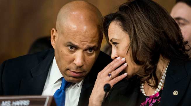 WASHINGTON, DC - Senators Corey Booker (D-NJ) and Kamala Harris (D-CA) speak quietly during Supreme Court nominee Brett Kavanaugh's confirmation hearing in the Senate Judiciary Committee on Capitol Hill in Washington, DC on Tuesday September 4, 2018. (Photo by Melina Mara/The Washington Post)
