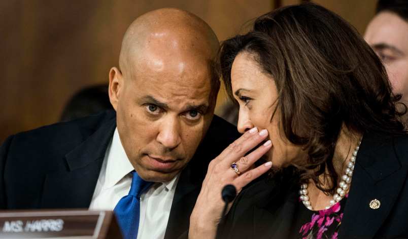 WASHINGTON, DC - Senators Corey Booker (D-NJ) and Kamala Harris (D-CA) speak quietly during Supreme Court nominee Brett Kavanaugh's confirmation hearing in the Senate Judiciary Committee on Capitol Hill in Washington, DC on Tuesday September 4, 2018. (Photo by Melina Mara/The Washington Post)