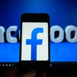 KRAKOW, POLAND - 2018/09/06: Facebook logo is seen on an android mobile phone in front of a computer screen with facebook sign. (Photo by Omar Marques/SOPA Images/LightRocket via Getty Images)