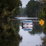 LONGS, SC - SEPTEMBER 21: A disabled car is surrounded by floodwaters caused by Hurricane Florence near the Todd Swamp on September 21, 2018 in Longs, South Carolina. Floodwaters are expected to rise in the area in through the weekend. (Photo by Sean Rayford/Getty Images)