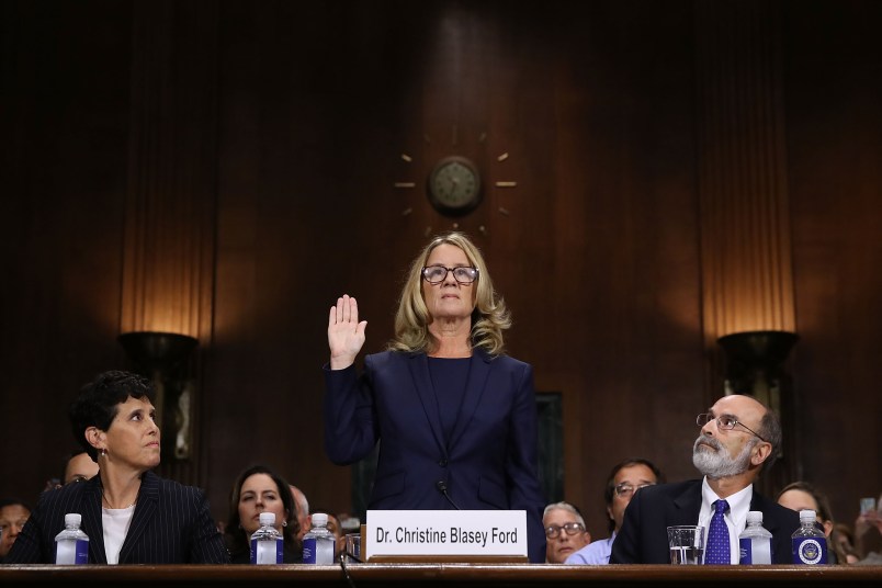 WASHINGTON, DC - SEPTEMBER 27:  Christine Blasey Ford (C) is sworn in before testifying the Senate Judiciary Committee with her attorneys Debra Katz (L) and Michael Bromwich (R) in the Dirksen Senate Office Building on Capitol Hill September 27, 2018 in Washington, DC. A professor at Palo Alto University and a research psychologist at the Stanford University School of Medicine, Ford has accused Supreme Court nominee Judge Brett Kavanaugh of sexually assaulting her during a party in 1982 when they were high school students in suburban Maryland. In prepared remarks, Ford said, ?I don?t have all the answers, and I don?t remember as much as I would like to. But the details about that night that bring me here today are ones I will never forget. They have been seared into my memory and have haunted me episodically as an adult.?  (Photo by Win McNamee/Getty Images)