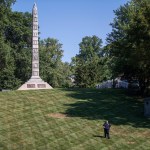 PLEASE HOLD FOR STORY SLUGGED CONFEDERATE CEMETERIES SECURITY BY JIM SALTER -  In this photo made Wednesday, Sept. 19, 2018, a security guard walks the grounds at North Alton Confederate Cemetery in Alton, Ill. The federal government has hired private security firms to guard several Confederate memorials across the U.S in the aftermath of clashes between white nationalists and counter-protesters last year. Information obtained by The Associated Press shows that nearly $3 million has been spent on contracted security since last summer and another $1.6 million is budgeted for similar protection in fiscal 2019. (AP Photo/Jeff Roberson)