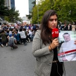 A journalist holding a poster with a photo of the missing Saudi writer Jamal Khashoggi, makes a piece on camera while covering a protest in his support near the Saudi Arabia consulate in Istanbul, Monday, Oct. 8, 2018.Turkish officials have said they believe that the journalist was slain in "a preplanned murder" at the kingdom's consulate and that his body was later removed. Saudi officials have denied the allegations as baseless.(AP Photo/Lefteris Pitarakis)