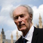 Former Norwegian war hero and resistance fighter Joachim Roenneberg, 93 years old, holds a Union flag as he walks in a park near the Palace of Westminster, after he received the Union Jack Medal for his efforts and cooperation with the British during the second World War, and especially at Vemork in Norway- 70 years ago, in London, Thursday, April  25, 2013. (AP Photo/Alastair Grant)