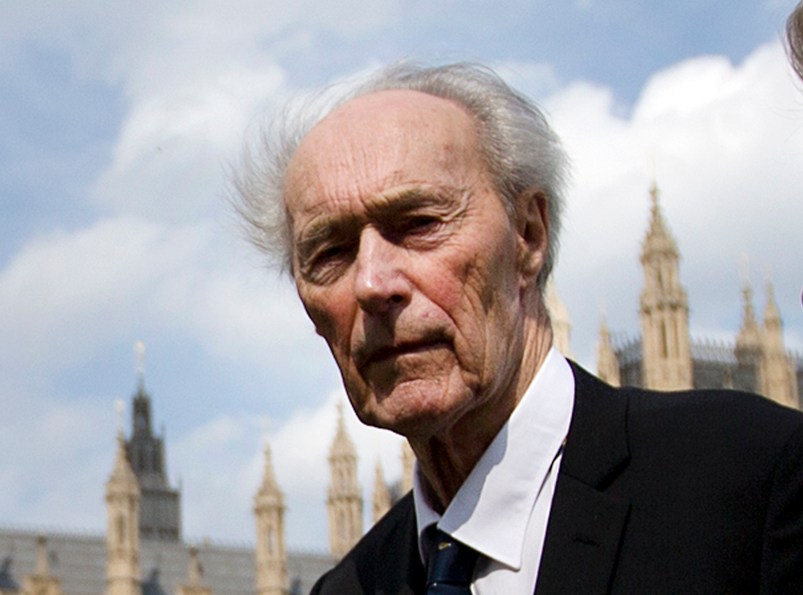 Former Norwegian war hero and resistance fighter Joachim Roenneberg, 93 years old, holds a Union flag as he walks in a park near the Palace of Westminster, after he received the Union Jack Medal for his efforts and cooperation with the British during the second World War, and especially at Vemork in Norway- 70 years ago, in London, Thursday, April  25, 2013. (AP Photo/Alastair Grant)