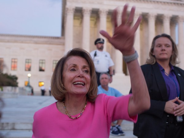 WASHINGTON, D.C. - OCTOBER 3: House minority leader Nancy Pelosi mingles with a crowd, mostly of women, who have gathered outside of the Supreme Court to oppose Judge Kavanaugh's nomination to the Supreme Court on the evening of October 3, 2018 in Washington, D.C. (Photo by Andrew Lichtenstein/Corbis via Getty Images)