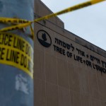 TREE OF LIFE SYNAGOGUE, PITTSBURGH, PENNSYLVANIA, UNITED STATES - 2018/10/29: Police tape wrapped around a traffic light pole out front of the Tree of Life Synagogue in Squirrel Hill outside of Pittsburgh. Members of Pittsburgh and the Squirrel Hill community pay their respects at the memorial to the 11 victims of the Tree of Life Synagogue massacre perpetrated by suspect Robert Bowers on Saturday, October 27. (Photo by Matthew Hatcher/SOPA Images/LightRocket via Getty Images)