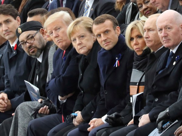 (From L) Canadian Prime Minister Justin Trudeau, Morocco's Prince Moulay Hassan, Moroccan King Mohammed VI, US First Lady Melania Trump, US President Donald Trump, German Chancellor Angela Merkel, French President Emmanuel Macron and his wife Brigitte Macron, Russian President Vladimir Putin and Australian Governor-General Peter Cosgrove attend a ceremony the Arc de Triomphe in Paris, France, as part of the commemorations marking the 100th anniversary of the 11 November 1918 armistice, ending World War I, Sunday, Nov. 11, 2018. (Ludovic Marin/Pool Photo via AP)