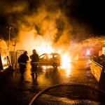 Israeli firefighters work at the scene where a rocket fired from the Gaza Strip hit in Sderot, Israel, Monday, Nov. 12, 2018. Israel's military says it is prepared to step up its efforts against Palestinian militants in the Gaza Strip if rocket fire at Israel continues. (AP Photo/Tsafrir Abayov)