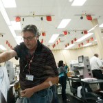 A worker loads ballots into machines at the Broward County Supervisor of Elections office during a recount on Tuesday, Nov. 13, 2018, in Lauderhill, Fla. (AP Photo/Brynn Anderson)