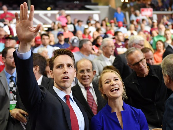 US senatorial candidate Attorney General Josh Hawley (l) and his wife Erin Morrow Hawleyare seen at a rally at JQH Arena in Springfield, Missouri on September 21, 2018. (Photo by MANDEL NGAN / AFP)        (Photo credit should read MANDEL NGAN/AFP/Getty Images)