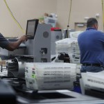 Employees of the Broward County Supervisor of Election's office in Lauderhill, Fla. counts ballots from the Mid-term election Thursday, Nov. 8, 2018. (Carline Jean/Sun Sentinel/TNS)