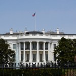 WASHINGTON, D.C. - APRIL 22, 2018:  An American flag flies over the south facade of the White House in Washington, D.C. Additional security fences and barriers were added along the south perimeter to prevent people from jumping the fence and entering the restricted White House grounds. The Secret Service tightened the security on the south side in 2017 by closing access to the entire fence line on the South Lawn. (Photo by Robert Alexander/Getty Images)