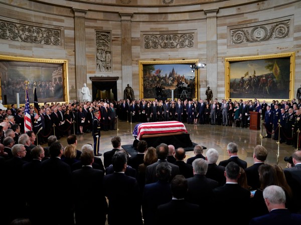 The flag-draped casket of former President George H.W. Bush lies in state in the Capitol Rotunda in Washington, Monday, Dec. 3, 2018. (AP Photo/Pablo Martinez Monsivais/Pool)