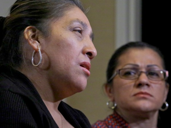 Sandra Diaz, right, listens as Victorina Morales, right recall her experience working at President Donald Trump's golf resort in Bedminster, N.J., during an interview, Friday Dec. 7, 2018, in New York. Both Morales and Diaz say they used false legal documents to get hired at the resort and supervisors knew it. (AP Photo/Bebeto Matthews)