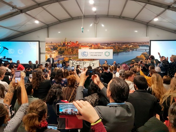 Youth and indigenous groups protest against fossil fuels during US-hosted event at the UN climate talks in Katowice, Poland, Monday, Dec. 10, 2018, as the COP24 UN Climate Change Conference takes place in the city. (AP Photo/Frank Jordans)