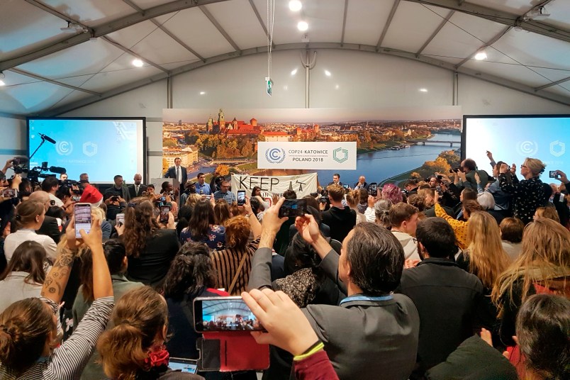 Youth and indigenous groups protest against fossil fuels during US-hosted event at the UN climate talks in Katowice, Poland, Monday, Dec. 10, 2018, as the COP24 UN Climate Change Conference takes place in the city. (AP Photo/Frank Jordans)