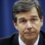 North Carolina Attorney General Roy Cooper, a Democrat, has condemned his state's Republican-sponsored voter ID law and constitutional amendment to ban same-sex marriage. But in his position he must defend the state against lawsuits on both issues. (Raleigh News & Observer/MCT)