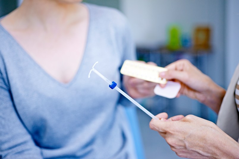 Doctor discussing contraceptive methods with a patient.