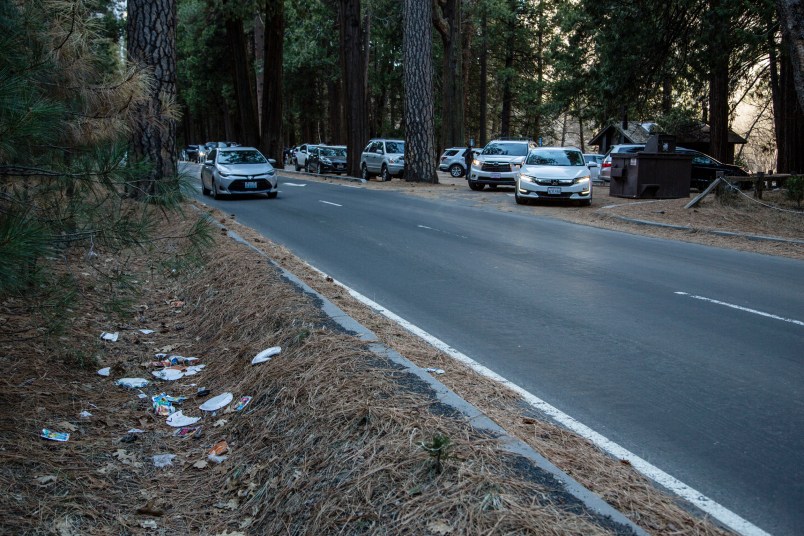 HOLD FOR PERMISSION-In this Monday, Dec. 31, 2018 photo provided by Dakota Snider shows a road lined with trash in Yosemite National Park, Calif. Human feces, overflowing garbage, illegal off-roading and other damaging behavior in fragile areas were beginning to overwhelm some of the West's iconic national parks on Monday, as a partial government shutdown left the areas open to visitors but with little staff on duty.(Dakota Snider via AP)