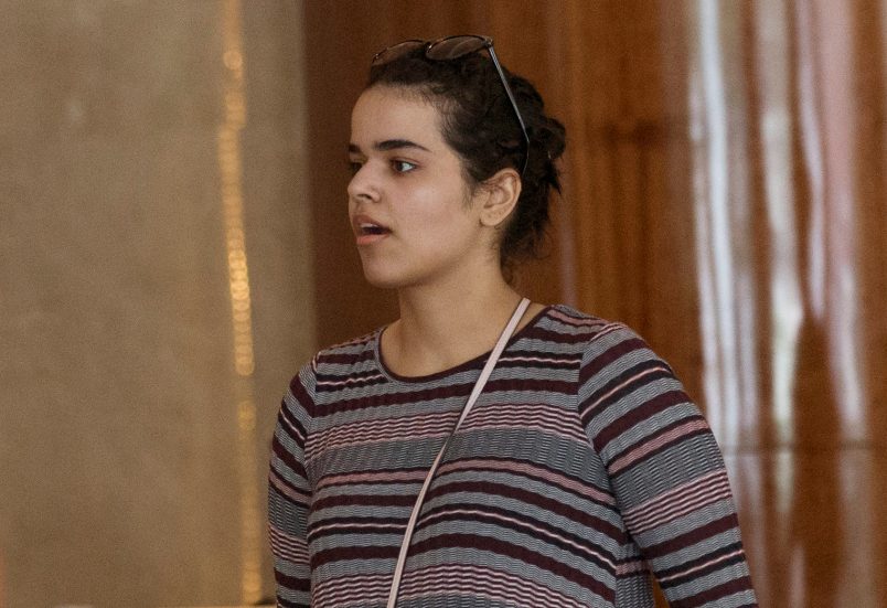Rahaf Mohammed Alqunun holds a mobile phone in Bangkok, Thailand, Friday, Jan. 11, 2019.  Alqunun, the 18-year old Saudi woman who fled her family to seek asylum, remains in Thailand under the care of the U.N. refugee agency as she awaits a decision by a third country to accept her as a refugee. (AP Photo/Sakchai Lalit)
