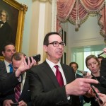 Treasury Secretary Steve Mnuchin, center, speaks with reporters as he departs the Republican policy luncheon on Capitol Hill, Tuesday, Jan. 15, 2019 in Washington. (AP Photo/Alex Brandon)