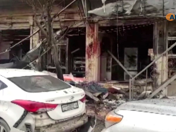 This frame grab from video provided by Hawar news, the news agency for the semi-autonomous Kurdish areas in Syria (ANHA), shows the damaged restaurant where explosion occurred near a patrol of the U.S.-led coalition, in Manbij town, Syria, Wednesday, Jan. 16, 2019. A Syrian war monitoring group and a local town council say an explosion has taken place near a patrol of the U.S.-led coalition and that there are casualties. (ANHA via AP)