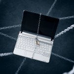 Chained laptop. Conception of sensitive data security.