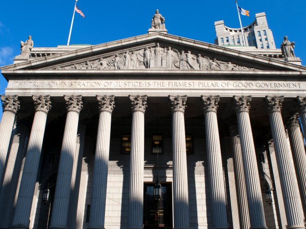 New York State Supreme Court building in Lower Manhattan showing the words "The True Administration of Justice" on its facade in Manhattan, New York, USA.