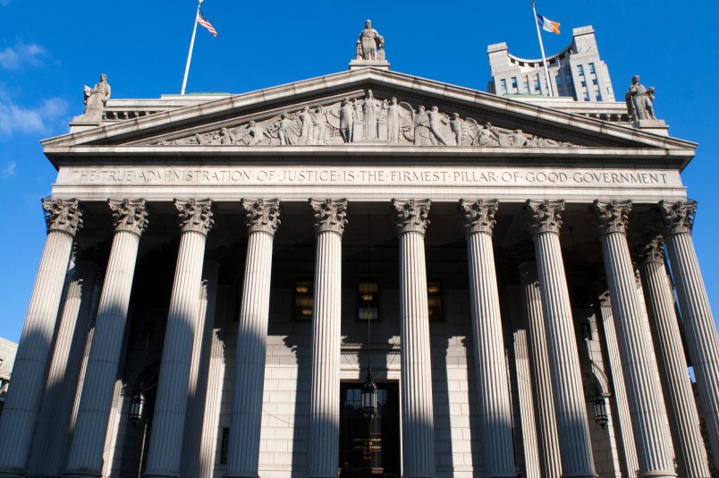 New York State Supreme Court building in Lower Manhattan showing the words "The True Administration of Justice" on its facade in Manhattan, New York, USA.