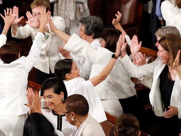 Women members of Congress, including Rep. Alexandria Ocasio-Cortez, D-N.Y., center, cheer after President Donald Trump acknowledges more women in Congress during his State of the Union address to a joint session of Congress on Capitol Hill in Washington, Tuesday, Feb. 5, 2019. (AP Photo/J. Scott Applewhite)