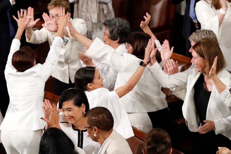 Women members of Congress, including Rep. Alexandria Ocasio-Cortez, D-N.Y., center, cheer after President Donald Trump acknowledges more women in Congress during his State of the Union address to a joint session of Congress on Capitol Hill in Washington, Tuesday, Feb. 5, 2019. (AP Photo/J. Scott Applewhite)