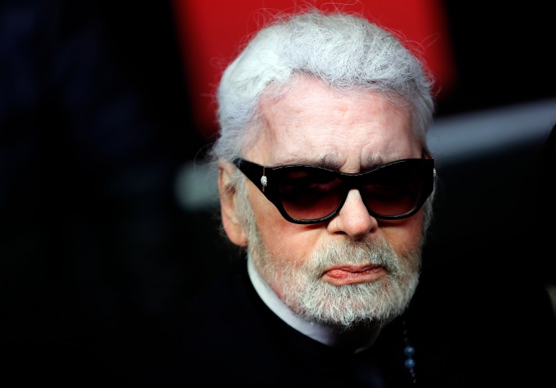 Fashion designer Karl Lagerfeld poses during the Champs Elysee Avenue illumination ceremony for the Christmas season, in Paris, Thursday, Nov. 22, 2018. (AP Photo/Christophe Ena)