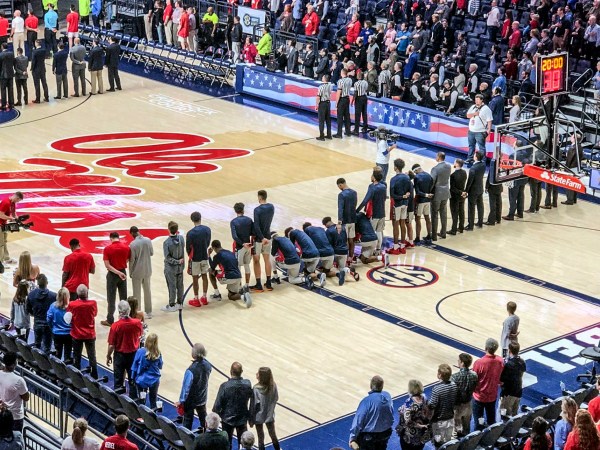 Six Mississippi basketball players take a knee during the National Anthem before the start of the game against Georgia at the Pavilion at Ole Miss in Oxford, Miss. on Saturday, February 23, 2019. (Nathanael Gabler, Oxford Eagle via AP)