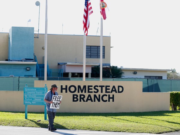 Josh Rubin demonstrates in front of the Homestead Temporary Shelter for Unaccompanied Children, Tuesday, Feb. 19, 2019, in Homestead, Fla. (AP Photo/Wilfredo Lee)