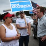 Pembroke, NC Heather McMillan Nakai talks with a congressional candidate, Dan McCready at Lumbee homecoming in Pembroke, NC.