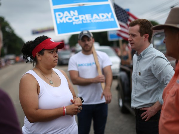 Pembroke, NC Heather McMillan Nakai talks with a congressional candidate, Dan McCready at Lumbee homecoming in Pembroke, NC.