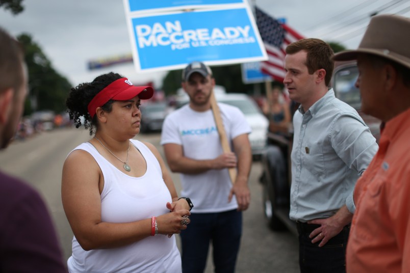 Pembroke, NC Heather McMillan Nakai talks with a congressional candidate, Dan McCready at Lumbee homecoming in Pembroke, NC.