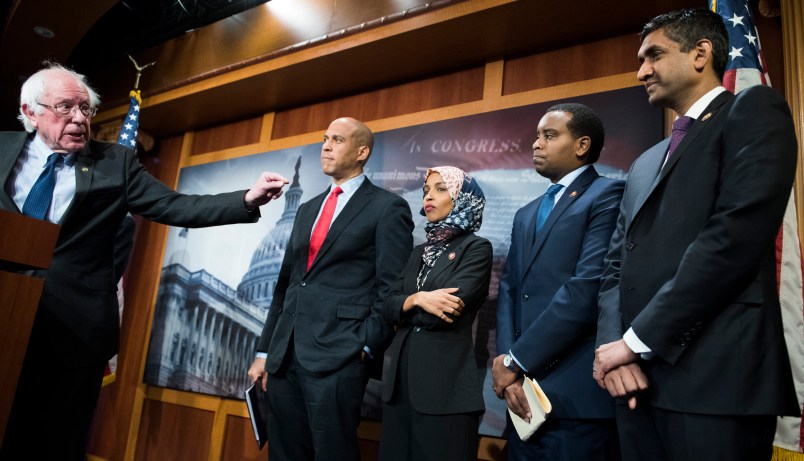 UNITED STATES - JANUARY 10: From left, Sens. Bernie Sanders, I-Vt.,  Cory Booker, D-N.J., Reps. Ilhan Omar, D-Minn., Joe Negues, D-Colo., and Ro Khanna, D-Calif., conduct a news conference in the Capitol to introduce a legislative package that would lower prescription drug prices in the U.S. on January 10, 2019. (Photo By Tom Williams/CQ Roll Call)