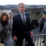 Virginia Gov. Ralph Northam, left,  and his wife Pam, left, leave the funeral of fallen Virginia State Trooper Lucas B. Dowell after the church service for the funeral at the Chilhowie Christian Church in Chilhowie, Va., Saturday, Feb. 9, 2019. Dowell was killed  in the line of duty earlier in the week. (AP Photo/POOL/Steve Helber)